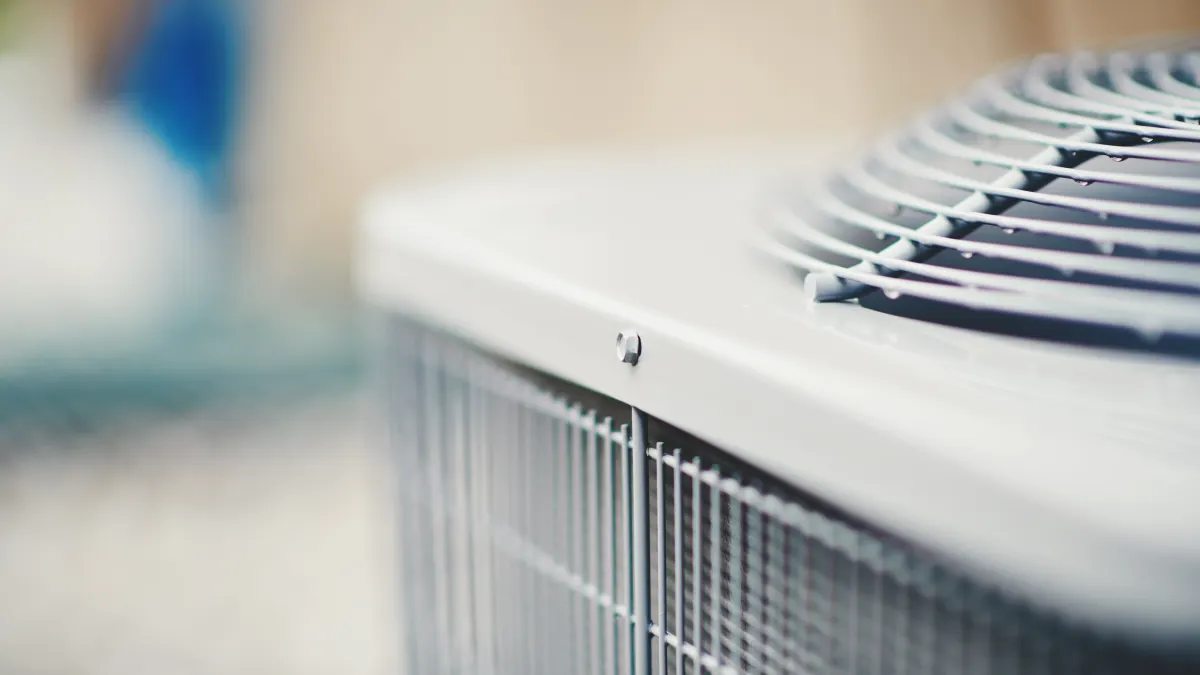 Air conditioner unit in residential garden Air conditioner unit in residential garden